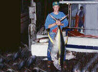 Father & Daughter with big yellowfin, Swordfish being boated
